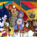 Plushy prizes hanging from a carnival booth